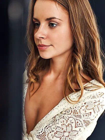 Young girl with beautiful face and smile likes to read books bei