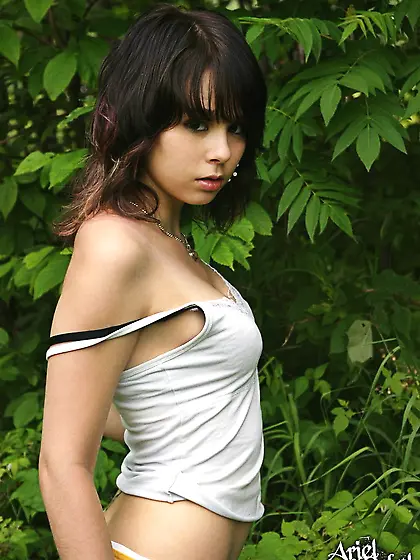 Slim Ariel Rebel allows a camera to look under her skirt and sho