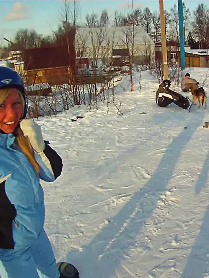 Sporty young blonde is enjoying outdoor winter...