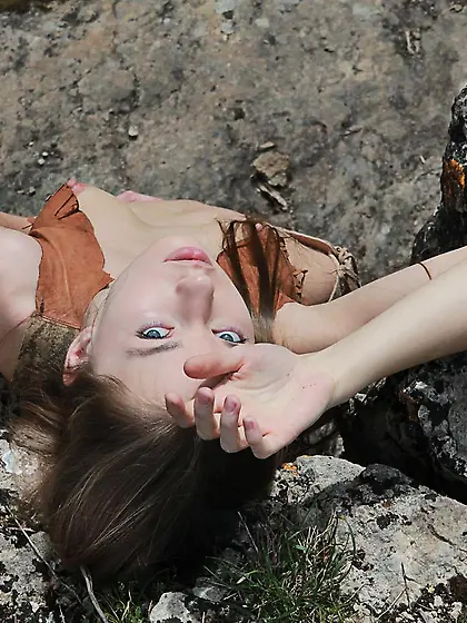 Stunning blonde teen girl Milena D poses by the river and makes