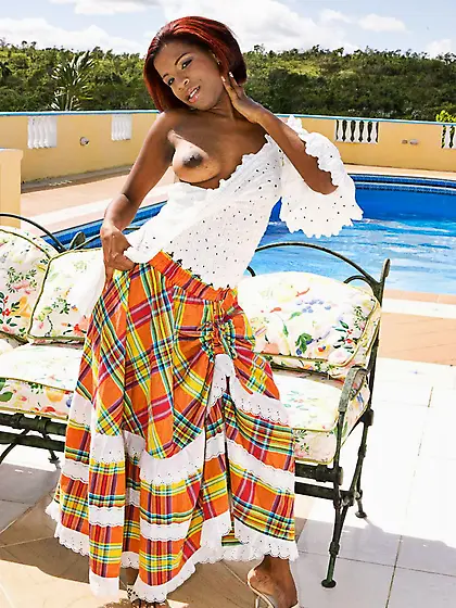 Black latina Madelin Crox in long dress enjoys white rod in her