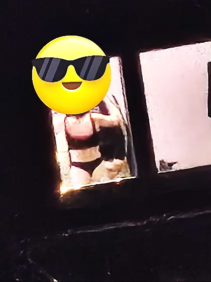 Old window peep pics---gal in her thongs