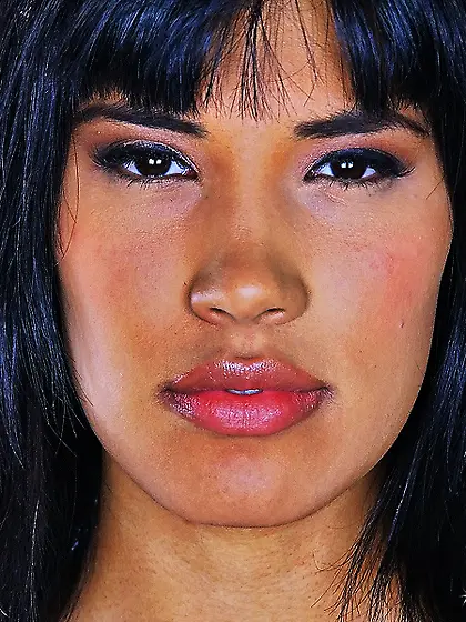 Morrigan Danu drops down her black leather jacket and gets her p