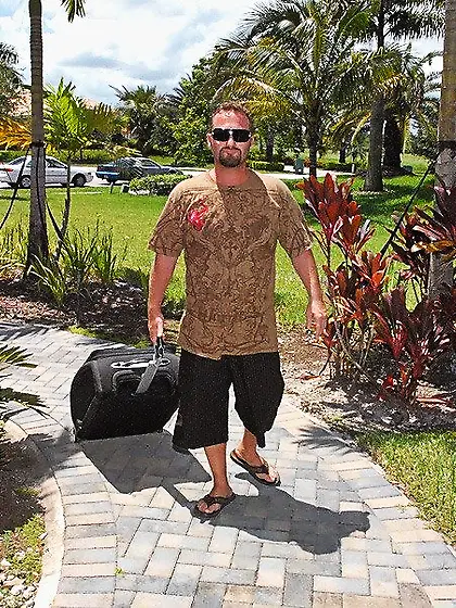 Busty blonde doesn't take off her white onesie during this