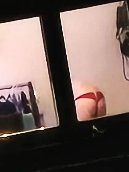 Old window peep pics---gal in her thongs