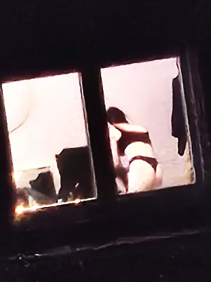 Old window peep pics---gal in her thongs