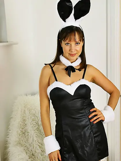 Bunny Cindy in high heeled boots and stockings unwraps her sexy