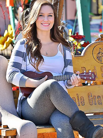 Smiling teen cutie shows her hairy pussy...