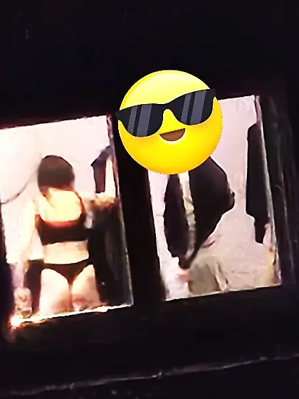 Old window peep pics---gal in her thongs