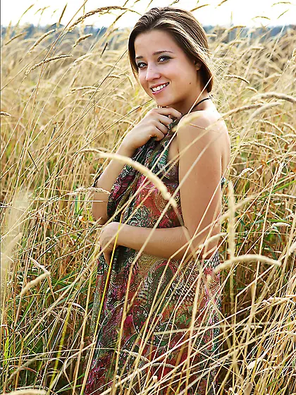 Hot and sexy girl Eva Shanti laid the blanket on the grass at th