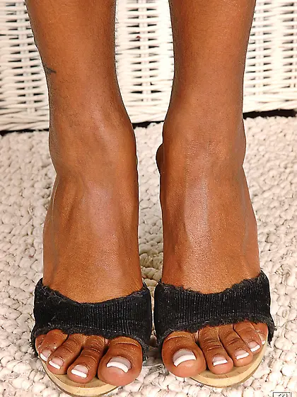 Busty black Tyra Lex teases with her long legs and giant boobs b