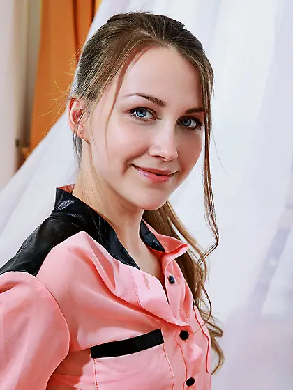 Blue-eyed and brown-haired teen shows off her sexy white stockin