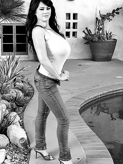 Busty brunette Rachel Aldana exposing her huge hot melons under