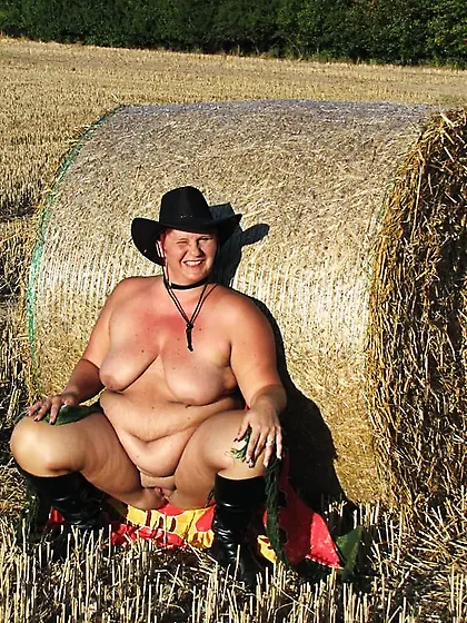 Anna naked on straw bales...
