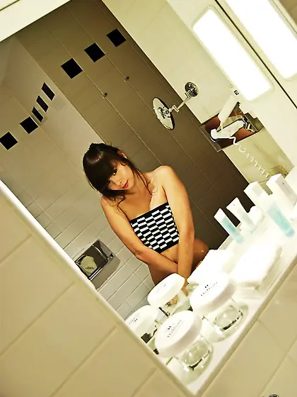 In the morning,  Ariel Rebel beautifies her body and plays with h