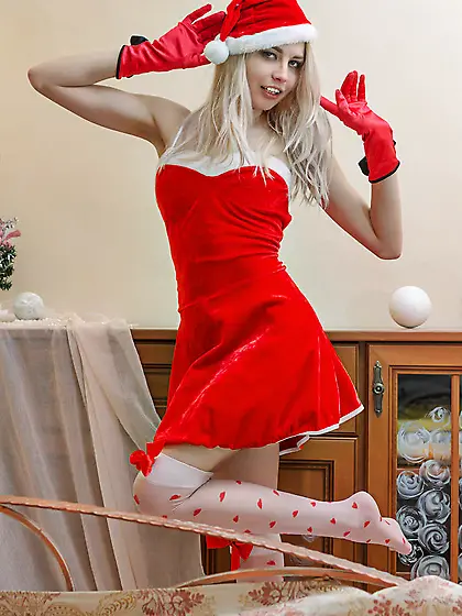 Slim blonde chick poses in sexy Xmas outfit and reveals her natu