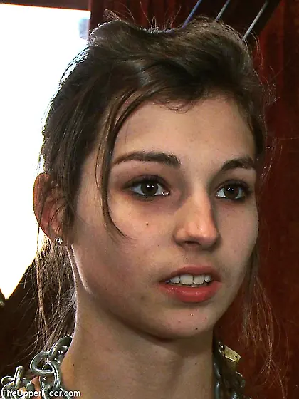 Lady holds vibrator clit