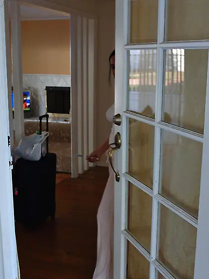 Exotic asian chick Dee Lily dressed in white flashes her perfect