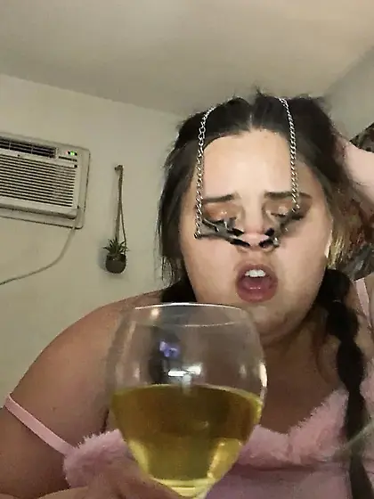 Fat piggy squats over wine glass