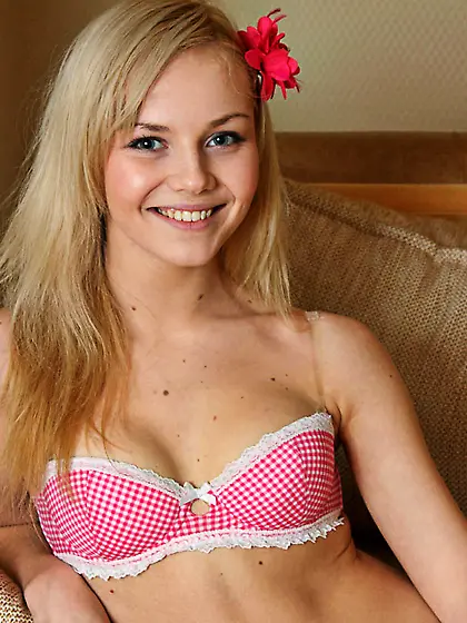 Petite teen blonde Aglaya Nubiles with red flower in her hair po