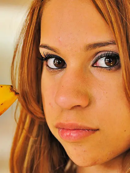 Effortlessly adorable babe going bananas with her oversized bana