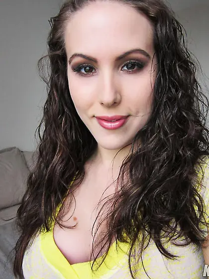 Adorable busty brunette Katie Banks strips and plays with her am