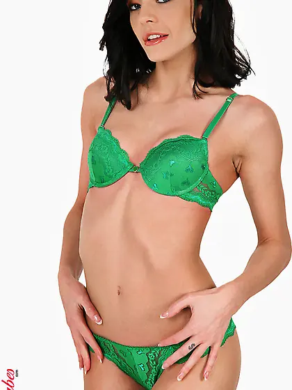 Good looking brunette babe Liz Valery strips her green lingerie