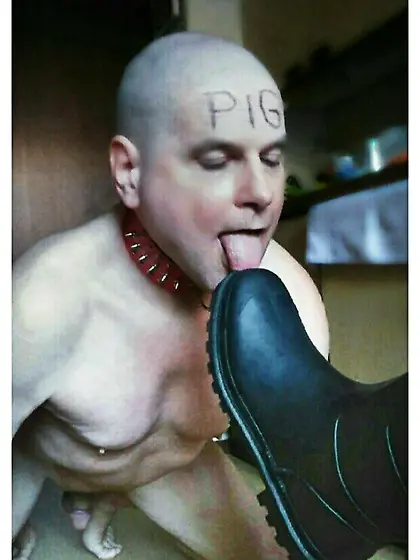 slave pig licks the dirt from my boot soles