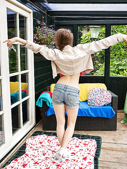 Pale-skinned slender babe exposes her small boobs and trimmed pu