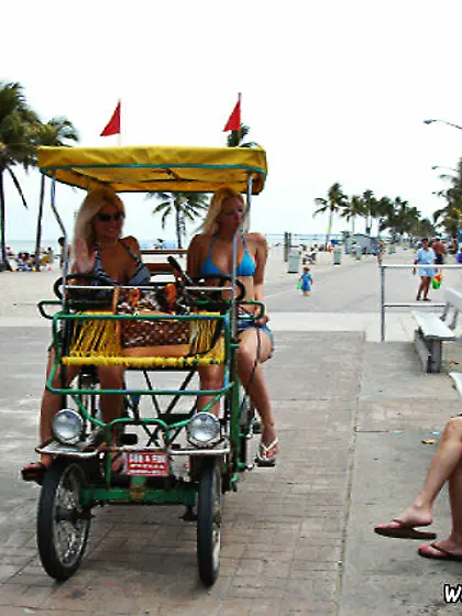 Two horny blonde bitches sharing a double-sided dildo on camera