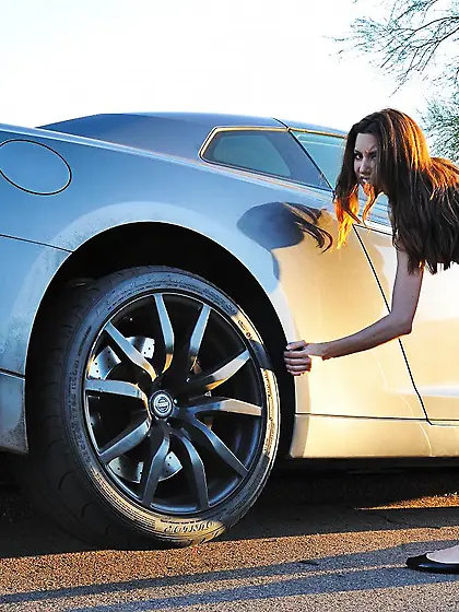 Brunette girl Lola Milano is in the luxurious car with tits nake