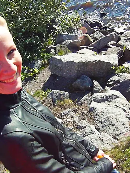 Smiling young blonde jeans