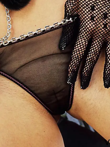 Gorgeous blonde Angie Savage in gloves and boots takes off her p