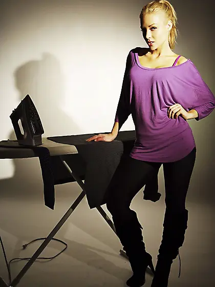 Stunning Kayden Kross performs a striptease dance while ironing