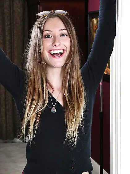 Very naughty young looking Lilith Black strips and poses in her