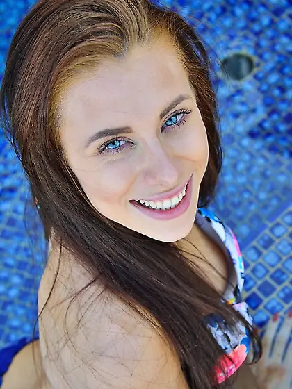 Inviting love with bright eyes rests by the pool with ribbed dil