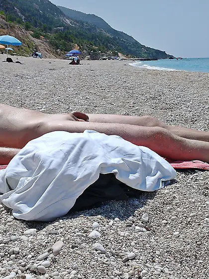 Naked hunk on the beach