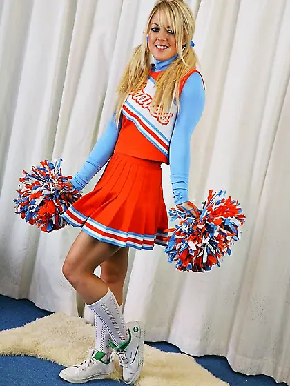 Sexy cheer girl Tanya P poses in her cheerleader uniform and sho