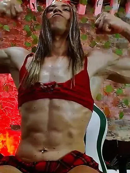 Tranny with huge muscles flexes her massive arms