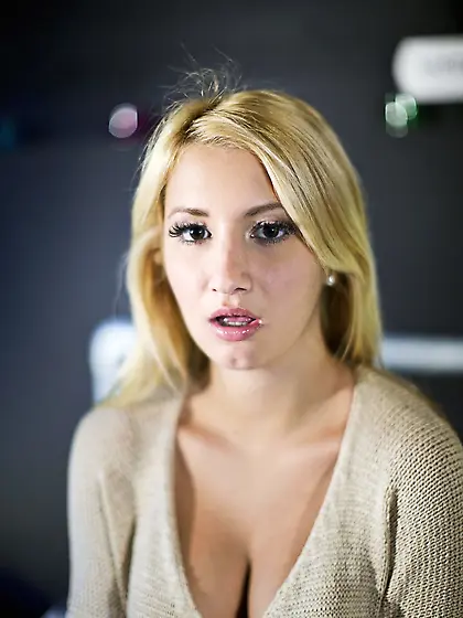 Enticing blonde strips naked and spreads legs to show her sweet