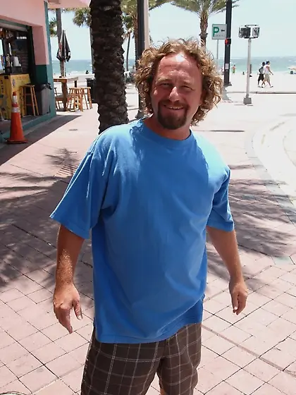 Tanned MILF in colorful panties giving a footjob before fucking