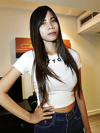 Thai chick with big tits shows her pointy nipples and such