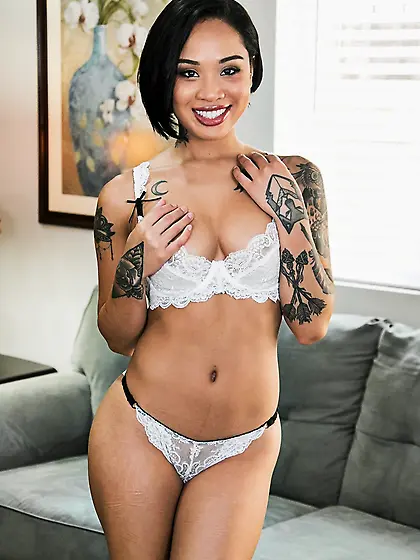 Hot tattooed doll erotically undresses to display her yummy tits