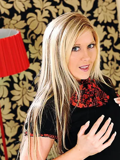 Busty blonde Michelle Barrett takes off her blue skirt and red p