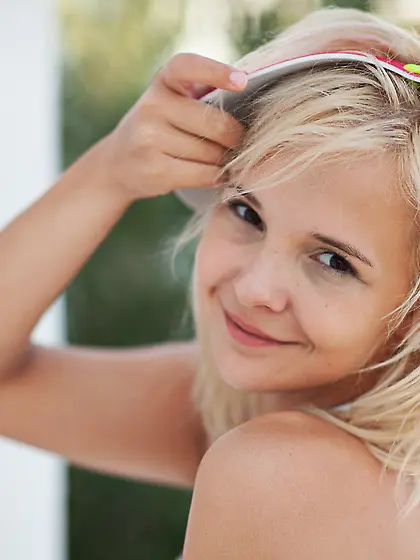 Blonde teen undresses balcony