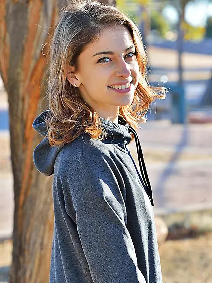 Cute young woman betrays tiny tits and vagina being filmed on ca