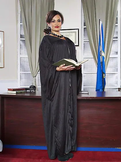 Salacious Judge Claudia Valentine is sliding her uniform down an