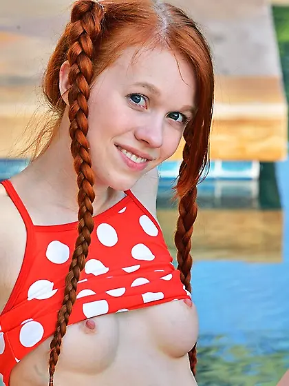 Pig tailed ginger stuffs a soda can in her...