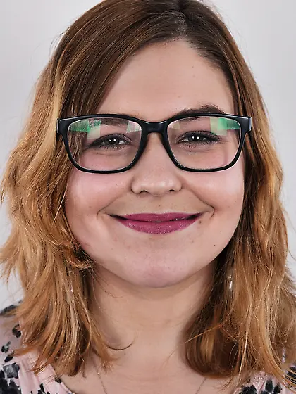 Fat whore with glasses rocks out in the porn studio trying strip