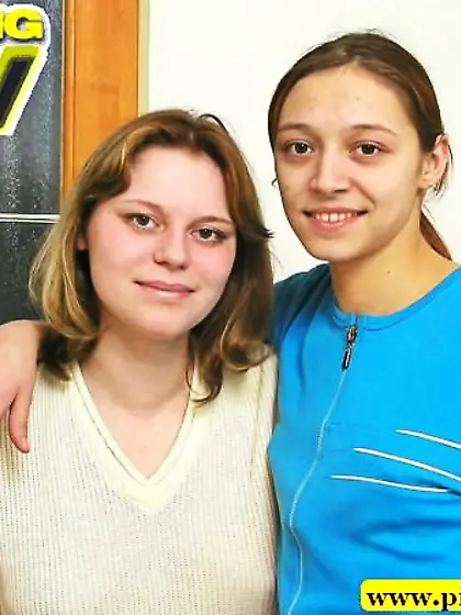 Lesbians helping to piss